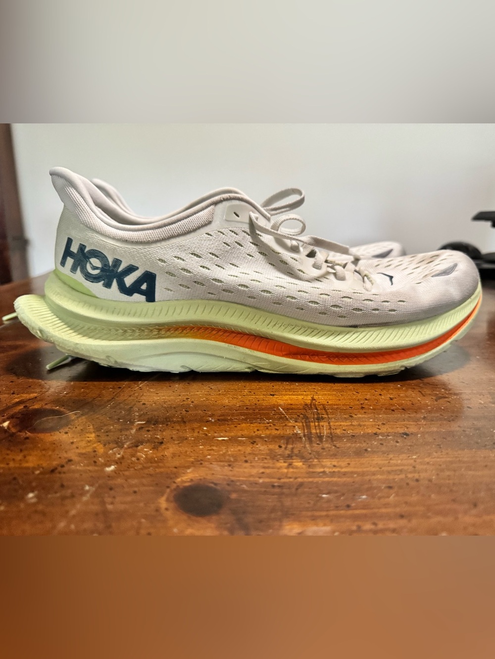 Hoka White and Orange Running Shoe with Green Midsole Accent